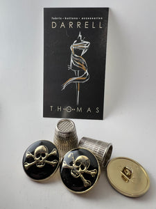 Gold & Black Enamel Covered Skull & Crossbones Button