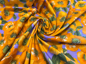 Orange Floral on Lavender two way stretch 95% Cotton 5% Elastane.  1/4 Metre Price