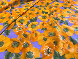 Orange Floral on Lavender two way stretch 95% Cotton 5% Elastane.  1/4 Metre Price