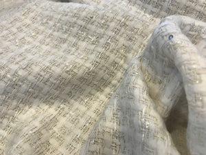 White/Ivory Couture Tweed  35% Wool 15% Acrylic 15% Polyester 10% Mohair 10% Alpaca 10% Cotton 5% Other.   1/4 Meter Price
