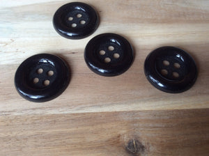 Black Four Hole Button.    Price per Button