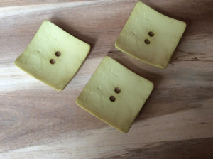 1 3/4" Yellow Square Buttons.   Price per Button