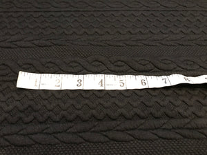 Black Textured Faux Cable knit 93% Polyester 5% Rayon 2% Spandex.    1/4 Meter Price