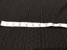 Load image into Gallery viewer, Black Textured Faux Cable knit 93% Polyester 5% Rayon 2% Spandex.    1/4 Meter Price