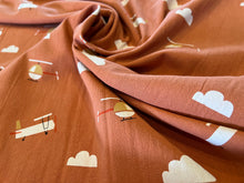 Load image into Gallery viewer, Terracotta Rust 100% Rustic Cotton Plane Print.  1/4 Metre Price