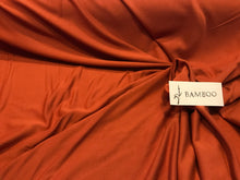 Load image into Gallery viewer, Burnt Orange 95% Bamboo 5% Spandex.    1/4 Meter Price